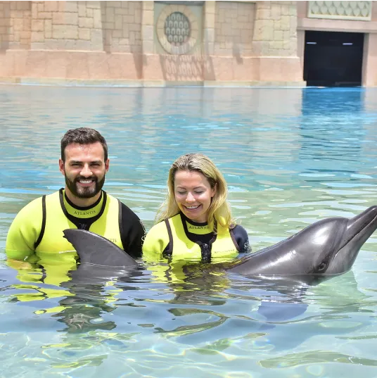 Niks Jansons with dolphins